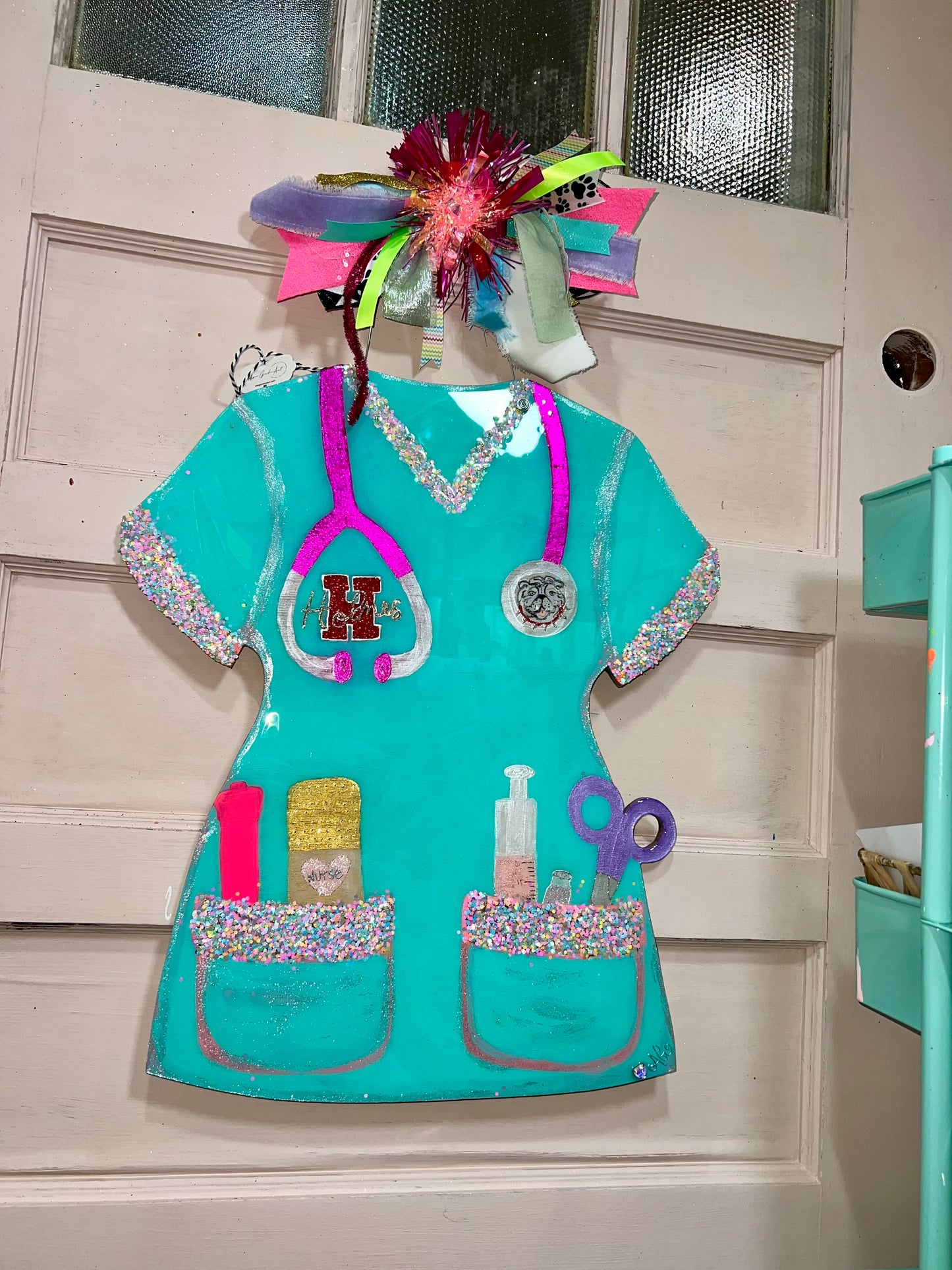 Scrub top door hanger